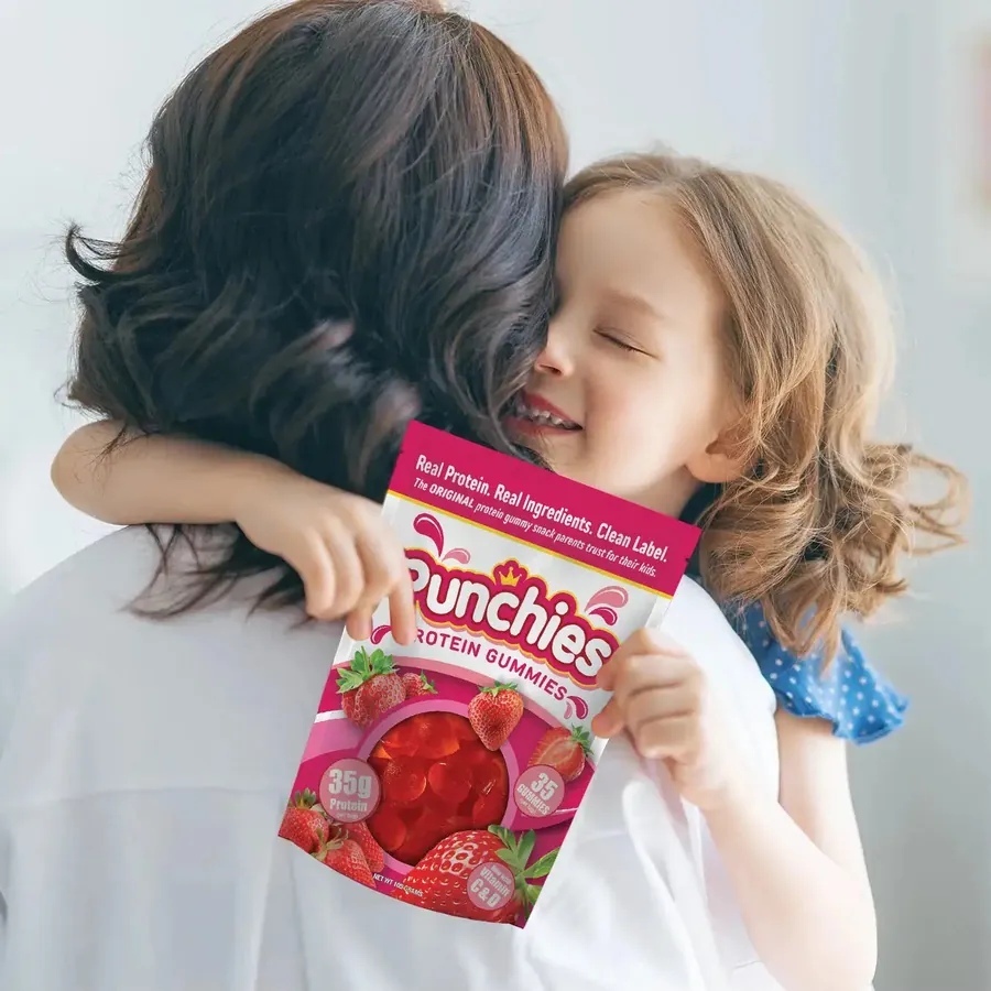 Best protein for kids: a parent hugging a child with a bag of Punchies protein gummies